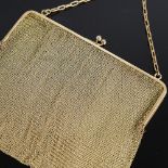 An Art Deco 9ct gold mesh evening bag/purse, 9ct cable link handle suspending a 9ct frame with