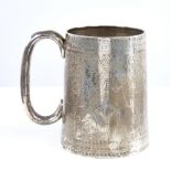 A Victorian silver pint tankard/mug, tapered cylindrical form with C-shaped handle, with engraved