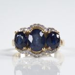 A modern 14ct gold sapphire and diamond triple-halo cluster ring, set with oval-cut sapphires and