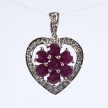 A modern 9ct white gold ruby and diamond cluster heart pendant, pendant height excluding bale
