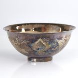 A Chinese sterling silver bowl, engraved phoenix and dragon decoration, stamped Made in Hong Kong,