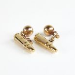 An early 20th century pair of 9ct gold bullet cufflinks, hallmarks Chester 1902, bullet length 22.