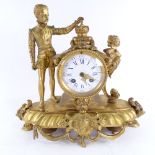 A 19th century French gilt-bronze 8-day figural mantel clock, surmounted by a Prince with a crown,