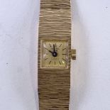DELVINA - a lady's Vintage 9ct gold mechanical wristwatch, gilt dial with baton hour markers,