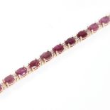 A modern 14ct rose gold ruby and diamond line bracelet, set with oval-cut rubies with double round