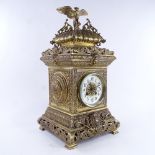 A large 19th century French brass architectural 8-day mantel clock, cream enamel dial with Arabic