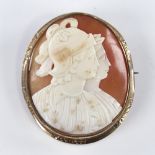 A 19th century relief carved shell cameo brooch, depicting 2 Classical profiles, in pinchbeck frame,