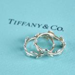 PALOMA PICASSO for TIFFANY & CO - a pair of modern sterling silver olive leaf band rings, band width