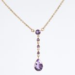 An Edwardian style 9ct gold amethyst line drop pendant necklace, set with round and pear-cut