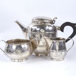 An Arts and Crafts unmarked silver 3-piece tea set, comprising teapot, 2-handled sugar bowl and