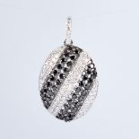 A modern 18ct white gold black and white diamond pendant, set with alternating stripes of round