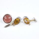 A pair of novelty unmarked white metal and citrine jockey cap cufflinks, cap length 32.5mm, and an