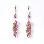 A modern pair of handmade unmarked gold pink sapphire cluster grape earrings, set with oval mixed-