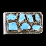 An unmarked Mexican silver and turquoise money clip, length 45.4mm, 21.5g Good overall condition,