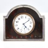 A George V silver and tortoiseshell pique inlaid desk clock, white enamel dial with Arabic