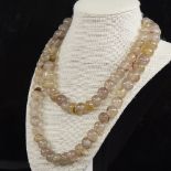 A long graduated polished chalcedony agate bead necklace, largest bead diameter 14.8mm, necklace