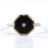 An early 20th century unmarked silver onyx and split pearl dress ring, set with octagonal-cut