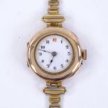 An early 20th century lady's 9ct rose gold mechanical wristwatch, white enamel dial with Arabic