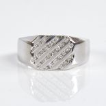 A modern 9ct white gold diamond signet ring, channel set with round brilliant-cut diamonds, total