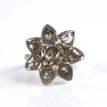 A 19th century Indian unmarked gold table-cut diamond floral ring, foiled backs, setting height 20.