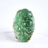 A large late 20th century 9ct gold jade panel ring, carved and pierced floral decoration, panel