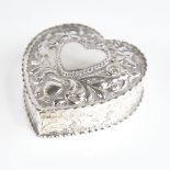 A Victorian silver heart-shaped trinket box and cover, relief embossed bird and foliate