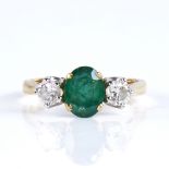 A mid-20th century unmarked high carat gold 3-stone emerald and diamond ring, set with oval mixed-
