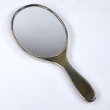 A George V silver-gilt hand mirror, by Asprey & Co, hallmarks London 1910, length 25cm Very good