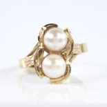 A modern Chinese unmarked high carat gold cultured pearl dress ring, setting height 15.3mm, size