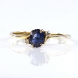 A modern handmade 14ct gold sapphire and diamond ring, set with oval mixed-cut sapphire and round