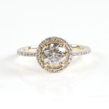 A modern 14ct gold diamond halo cluster ring, set with round brilliant-cut diamonds and diamond