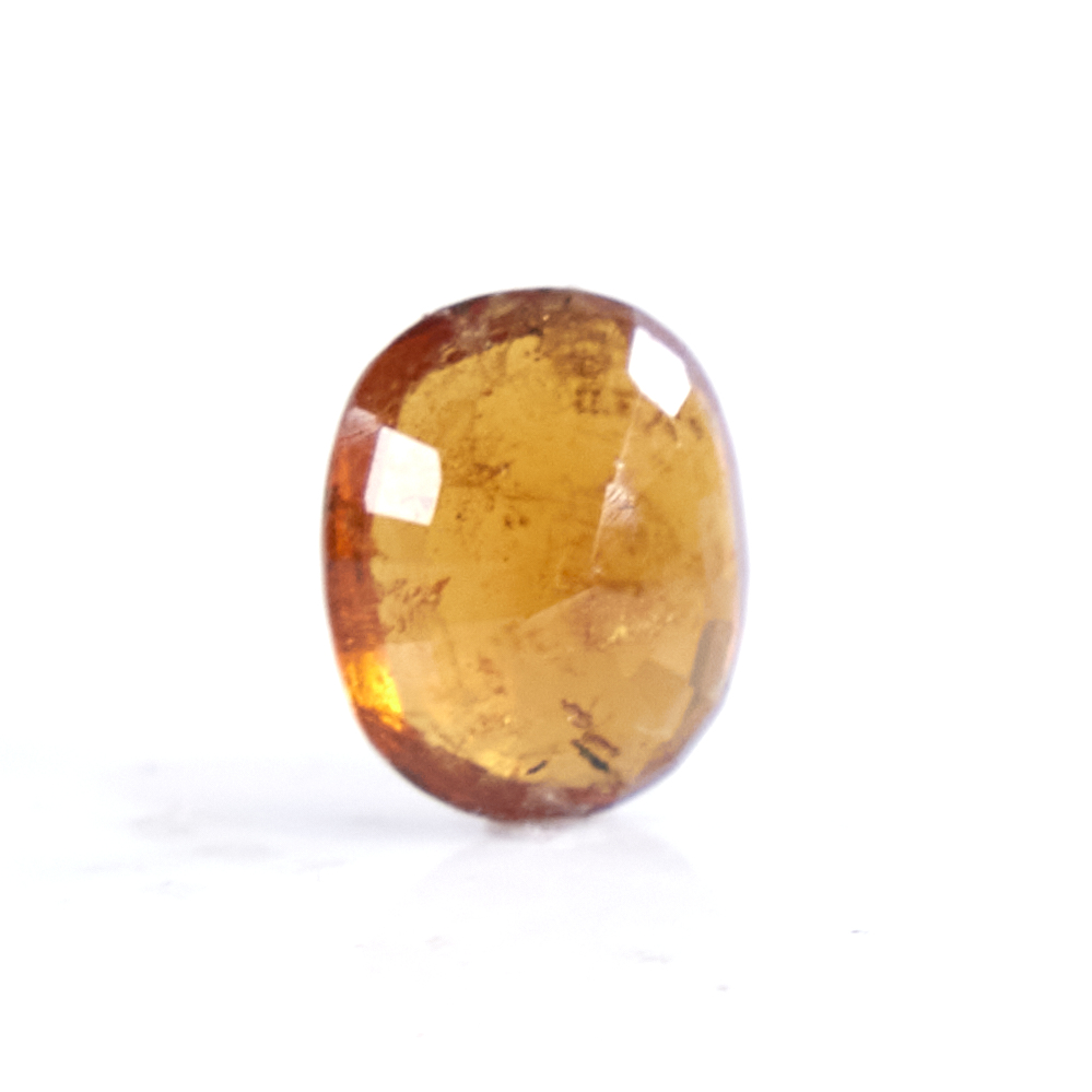 A 5.40ct unmounted oval mixed-cut hessonite garnet, dimensions: 13.00mm x 11.10mm x 6.00mm, 1.08g, - Image 3 of 5