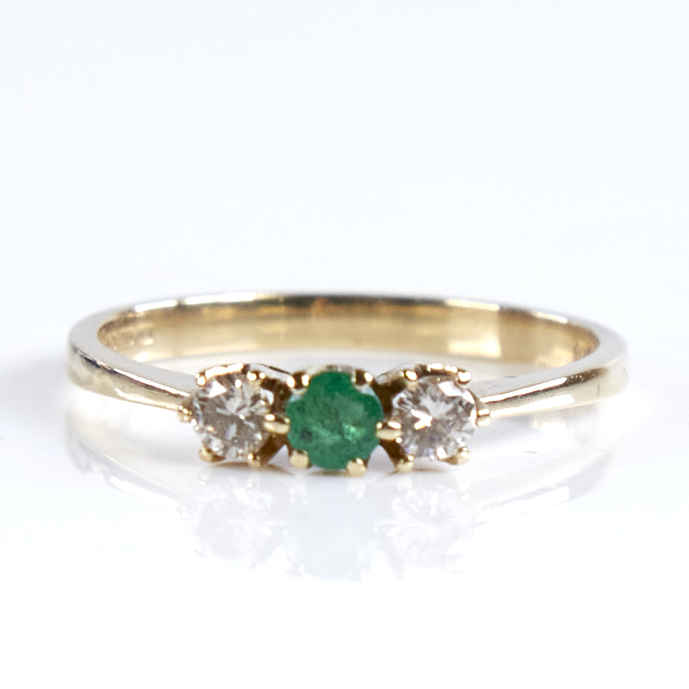 A late 20th century 9ct gold 3-stone emerald and diamond ring, total diamond content approx 0.2ct,