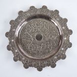 A late 19th/early 20th century Indian unmarked white metal pin dish, allover relief embossed foliate