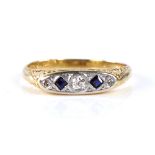 An early 20th century 18ct gold graduated 5-stone sapphire and diamond half hoop ring, set with