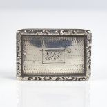 A William IV silver vinaigrette, rectangular form with cast floral border and engine turned