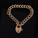 An early 20th century 9ct rose gold hollow curb link heart padlock charm bracelet, hallmarks Chester