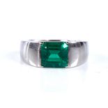 A Colombian emerald ring, rectangular emerald-cut emerald weighing approx 2.42ct bezel-set in