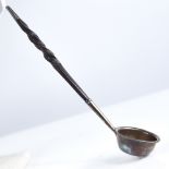 A small Georgian unmarked silver and whale baleen-handled toddy ladle, length 18cm Good overall