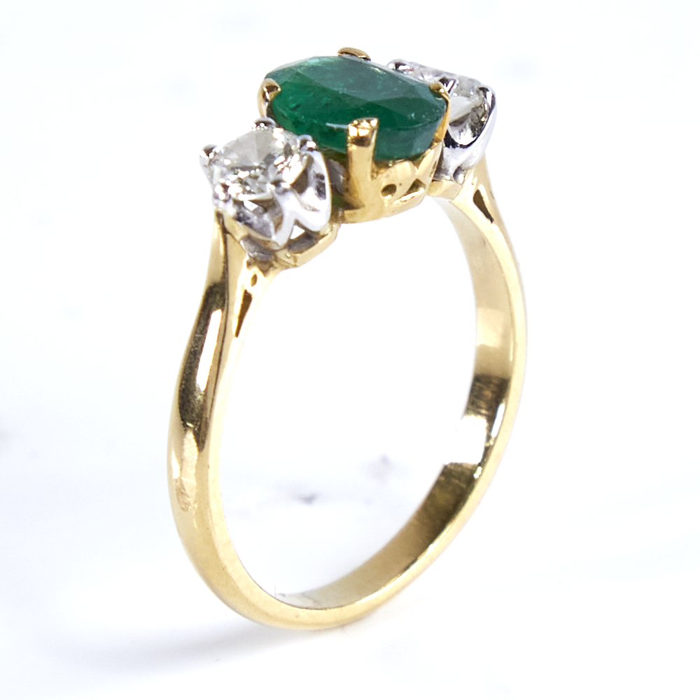 A mid-20th century unmarked high carat gold 3-stone emerald and diamond ring, set with oval mixed- - Image 4 of 5