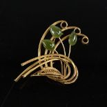 An eastern unmarked gold and jadeite floral brooch, brooch length 60mm, 8.4g Good original