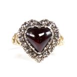 A Georgian style unmarked gold heart-shaped cabochon garnet and rose-cut diamond cluster ring,