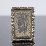 A George III silver vinaigrette, rectangular form with relief floral border and bright-cut