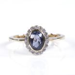 A modern 14ct gold sapphire and diamond cluster ring, set with oval-cut sapphire and round