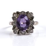 A late 20th century 9ct gold amethyst and diamond cluster dress ring, set with oval-cut amethyst and