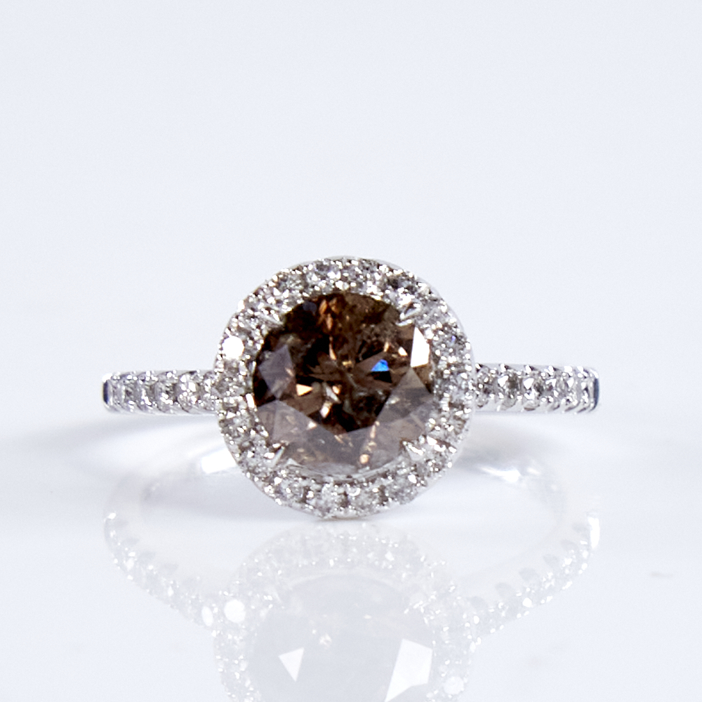 A modern 14ct white gold fancy orange brown and colourless diamond halo cluster ring, set with round