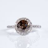 A modern 14ct white gold fancy orange brown and colourless diamond halo cluster ring, set with round