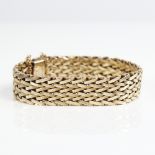 A Vintage 9ct gold bracelet, textured articulated form, band width 14.9mm, bracelet length 18cm,