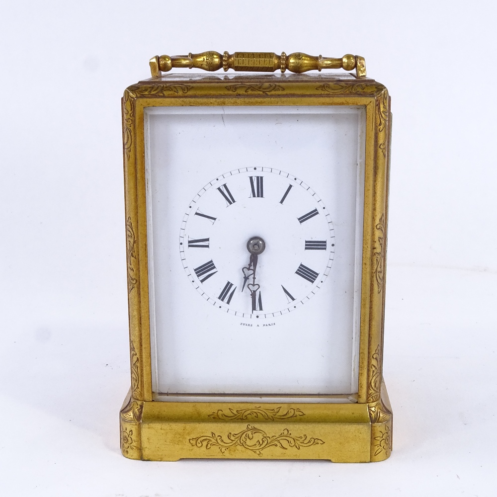 A 19th century French brass 8-day striking carriage clock, by Jules of Paris, white enamel dial with