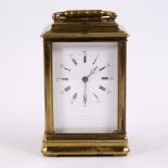 A 19th century brass-cased repeating carriage clock, white enamel dial with Roman numeral hour